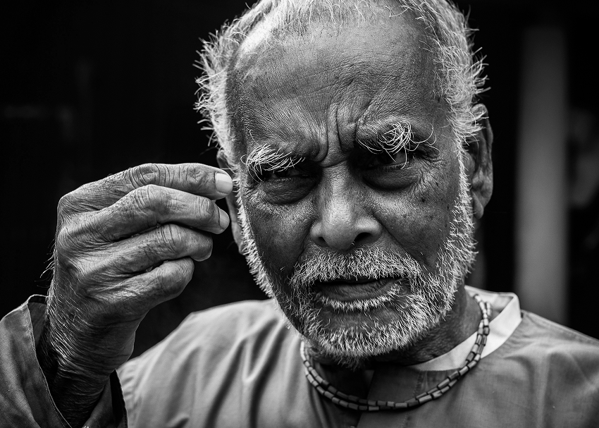 Elderly woman smiling during an eye exam